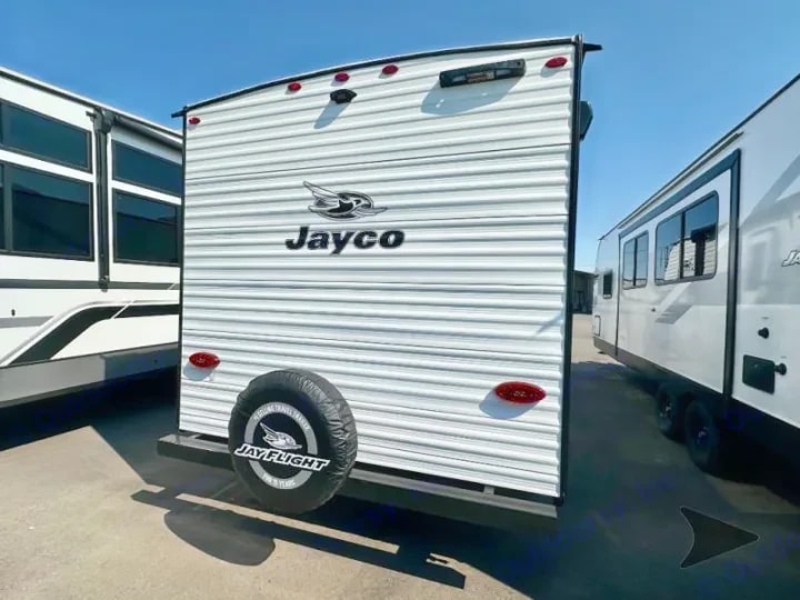 Rear exterior view with mounted spare tire and Jay Flight badging