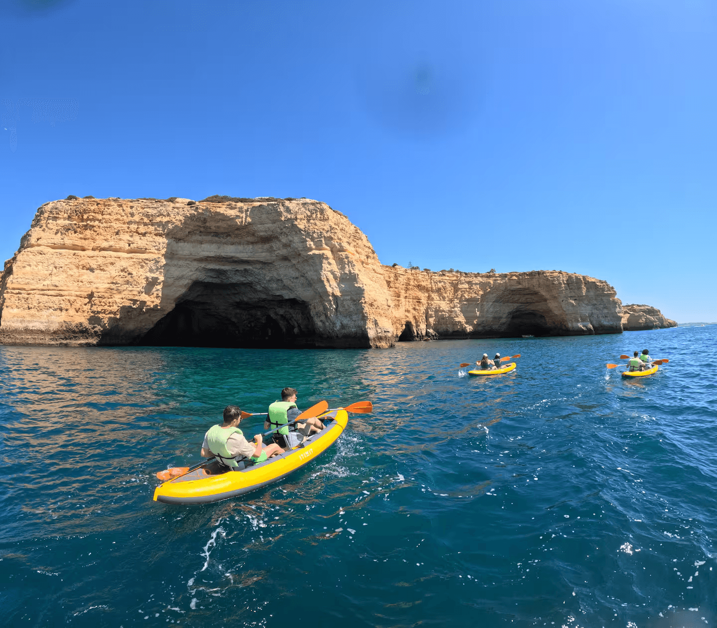 Kayaks along the Algarve cliffs
