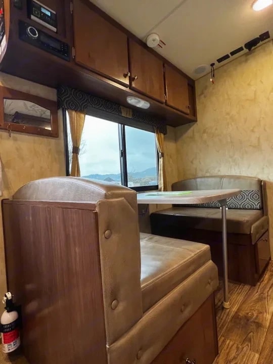 Dinette booth seating with a mountain view through the window