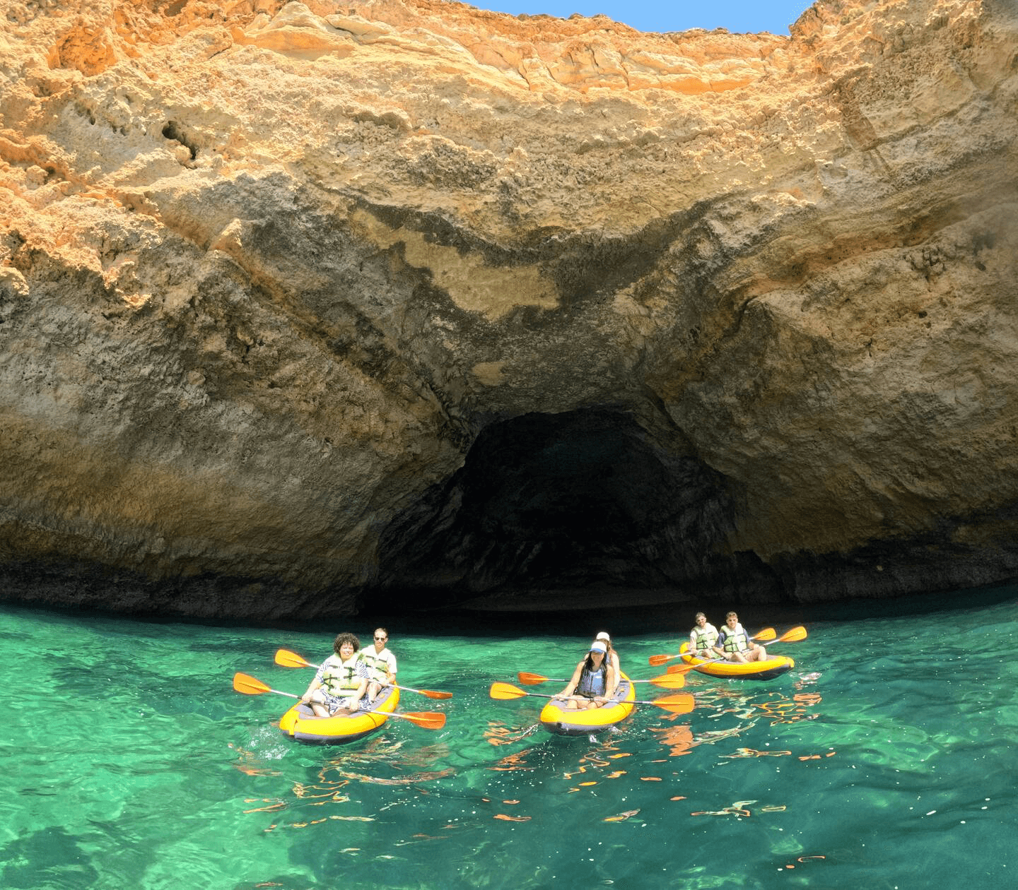 Approaching a cave mouth on turquoise water