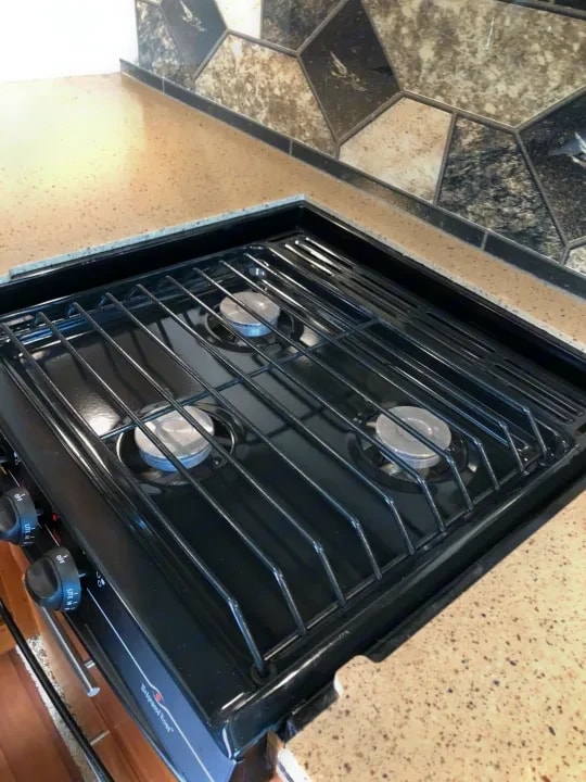 Close-up of the three-burner gas stovetop and grates