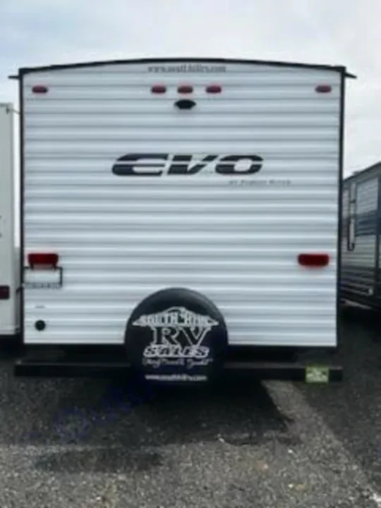 Rear exterior view of the trailer with spare tire mount and Evo logo