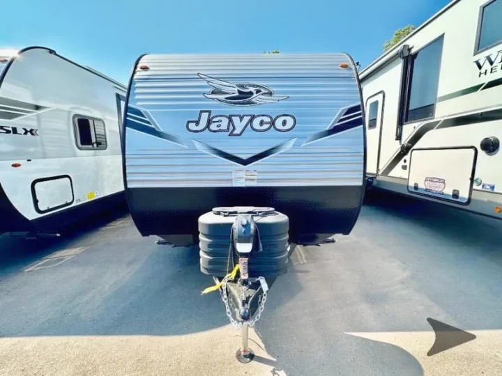 Front exterior view of the trailer showing propane tanks and hitch
