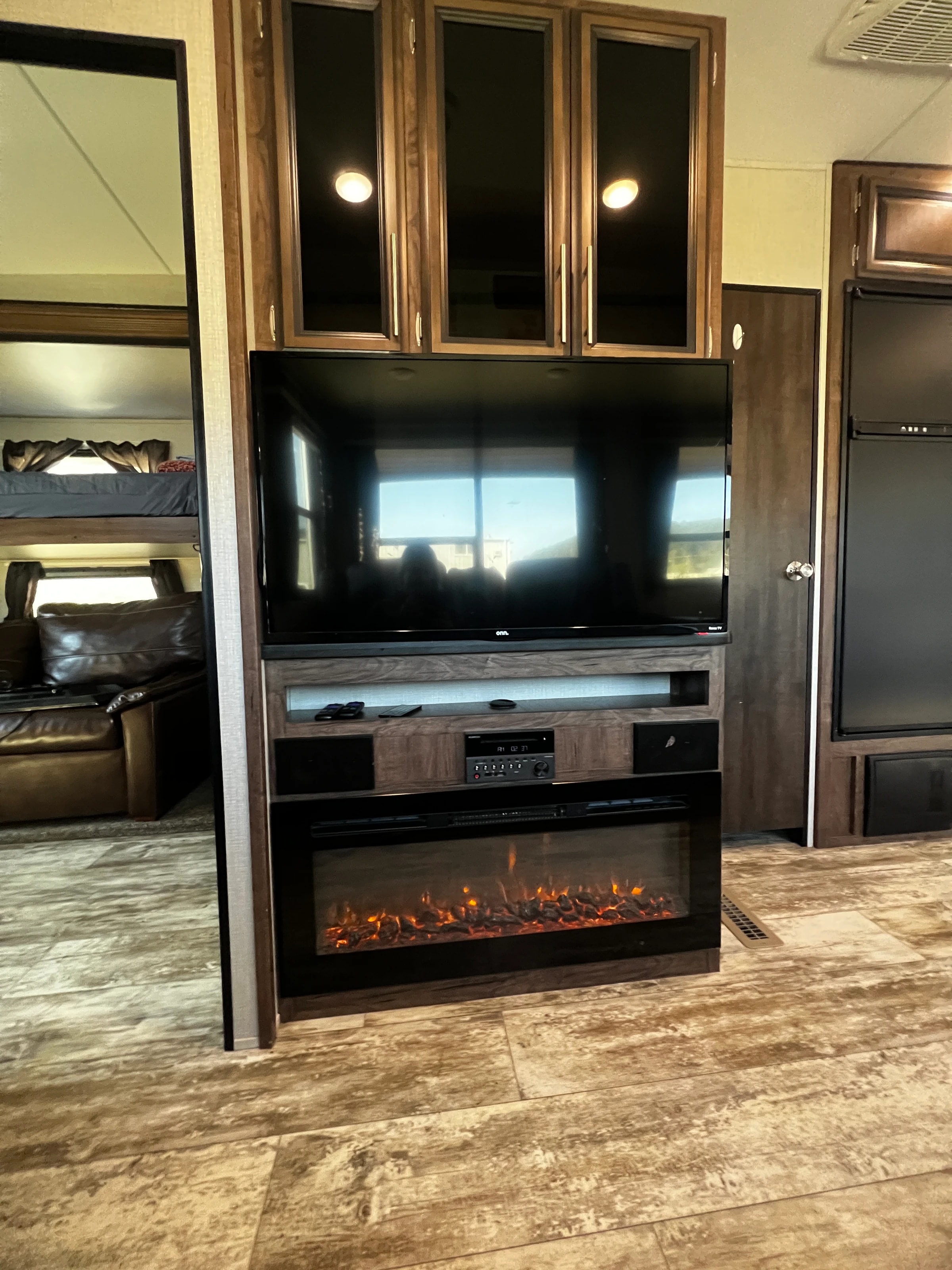 Living area with the electric fireplace under the television