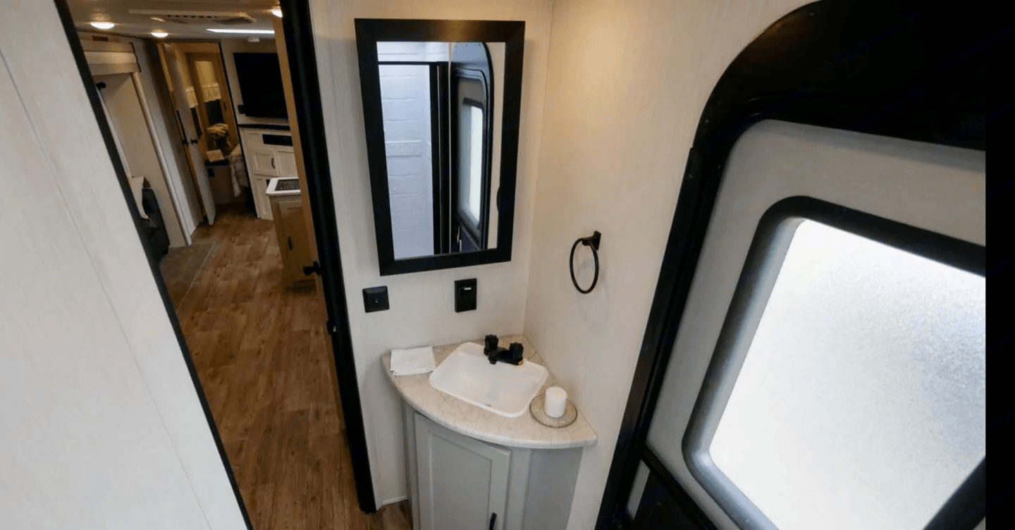Wet bath with a sink and shower